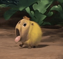 a yellow cartoon animal with its tongue hanging out is walking on the ground .