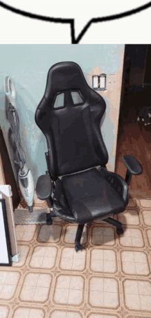 a black racing chair is sitting on a tiled floor