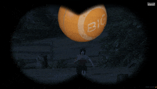 a woman runs in front of a big orange in a video game