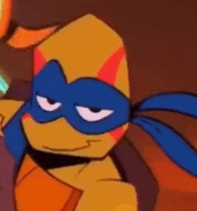 a close up of a teenage mutant ninja turtle wearing a blue mask and a yellow cape .