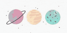 a drawing of three planets with rings around them on a white background