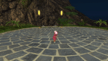 a girl in a pink dress stands in a circle on a brick walkway