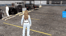 a woman is standing in a parking lot looking at a car with a license plate that says x-xxx