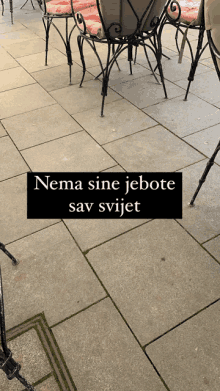 a sign that says nema sine jebote sav svijet is on a tiled floor