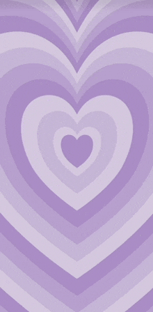 a purple background with a heart shaped pattern on it