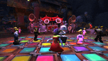 a group of cartoon characters are dancing on a colorful dance floor in a video game