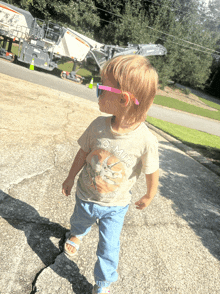 a toddler wearing sunglasses and a no-milk shirt