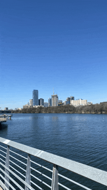 a large body of water with a city in the background