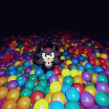 a shadow the hedgehog is sitting in a ball pit