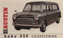 a black austin baby 850 countryman is sitting on top of a white surface .