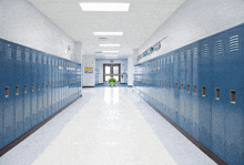 a row of blue lockers in a hallway with a sign on the wall that says exit