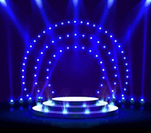 a stage with a podium and a circle of lights on it .