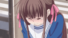 a girl in a sailor suit is crying with tears running down her face