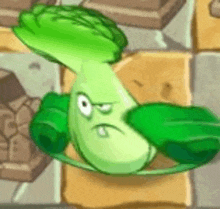 a cartoon character of a green cabbage with an angry face is sitting on a brick floor .