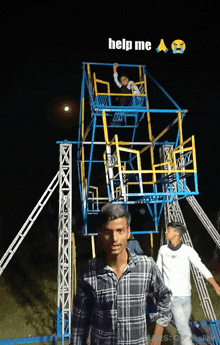 a man in a plaid shirt stands in front of a ferris wheel with the words help me written above him