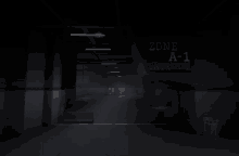 a dark hallway with a sign that says zone a- 1 entrance