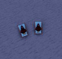 two chickens are laying on lawn chairs in the sand