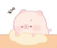 a pink pig is laying on a pillow on a table and looking at the camera .