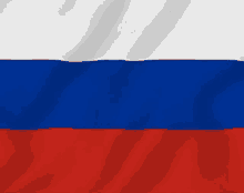 a close up of the russian flag waving in the wind .