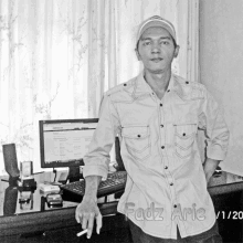 a black and white photo of a man with fadz arie written on the shirt