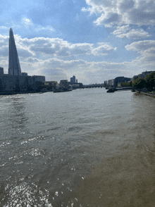 a large body of water surrounded by buildings and a bridge