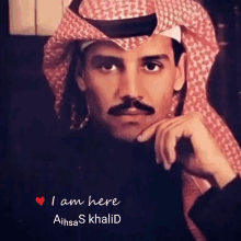 a picture of a man with a mustache and the words i am here aihsas khalid