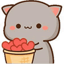 a cat is holding a bucket of hearts in its mouth .