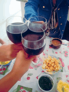 a group of people toasting with wine glasses