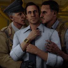 a man wearing a watch is surrounded by two men in military uniforms