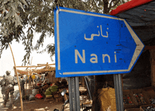 a blue sign that says nani on it in white letters