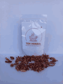 a bag of teh herbal sits on a white surface