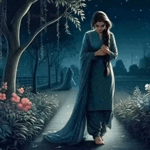 a woman is walking down a path at night .