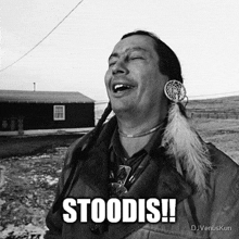 a black and white photo of a native american with the caption stoodis !!