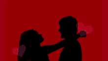 a silhouette of a man and woman kissing with the words " i love you " above them