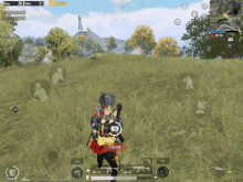 a screenshot of a game called pubg mobile shows a person standing in a field