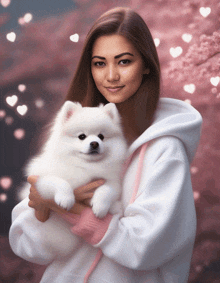 a woman holds a small white dog in her arms