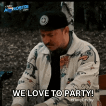 a man wearing a hat and a jacket says " we love to party "