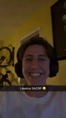 a man wearing headphones says i destroy sacrp on a snapchat