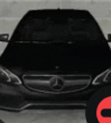 a black mercedes benz is parked in a parking lot with a red circle in the background .