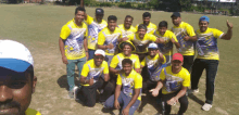 a group of men are posing for a picture and one of them is wearing a shirt that says ' india ' on it