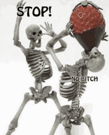 two skeletons are standing next to each other and one is holding a strawberry in his hand .