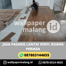 a poster for wallpaper malang shows a man installing wooden flooring