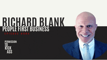 a man in a suit and tie is smiling in front of a sign that says richard blank