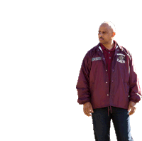 a man wearing a maroon jacket that says braun