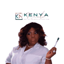 a woman holding a toothbrush in front of a kenya nicole logo