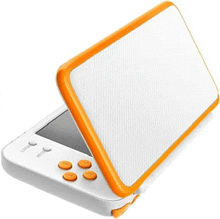 a white and orange nintendo 2ds is open and ready to be used