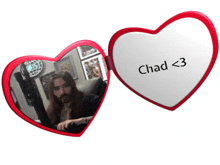 a heart shaped mirror with chad < 3 written on the inside