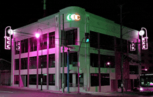 a building with ccc written on it is lit up at night