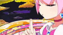 a pink haired anime girl is holding her finger to her lips .