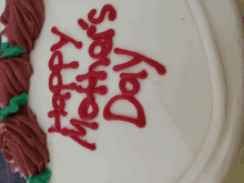 a cake that says happy mother 's day in red frosting